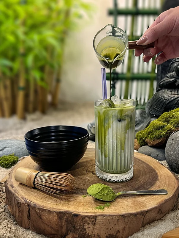 Matcha drink styled in outdoor garden setting